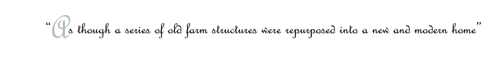 As though a series of old farm structures were repurposed into a new and modern home